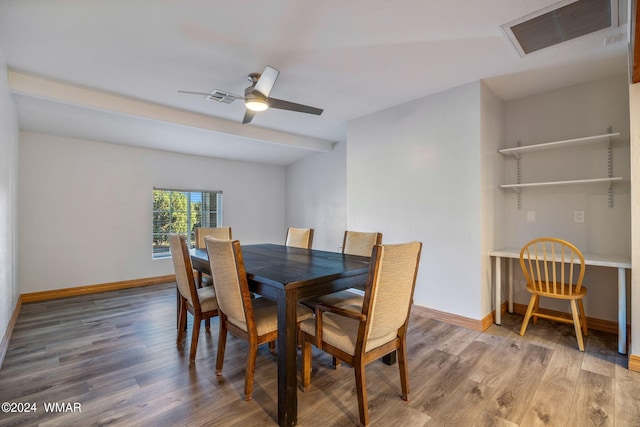 dining room featuring ceiling fan, baseboards, visible vents, and wood finished floors