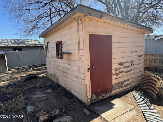 view of shed with fence