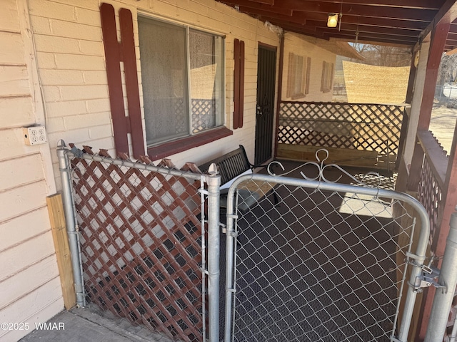 view of gate with fence