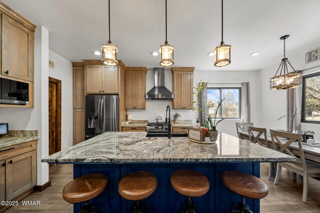 2872 Penny Ln, Lakeside, AZ 85929 - kitchen featuring wall chimney exhaust hood, stainless steel fridge with ice dispenser, wood finished floors, recessed lighting, and black microwave