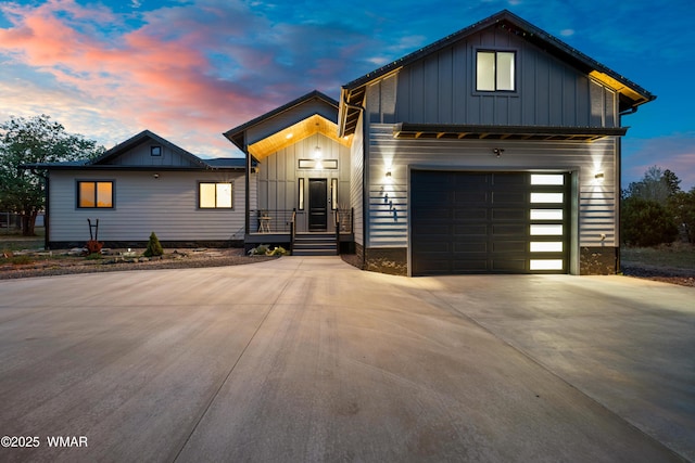 2872 Penny Ln, Lakeside, AZ 85929 - view of front facade featuring board and batten siding, driveway, and a garage