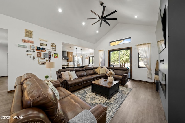 2872 Penny Ln, Lakeside, AZ 85929 - living room with ceiling fan, wood finished floors, high vaulted ceiling, recessed lighting, and baseboards