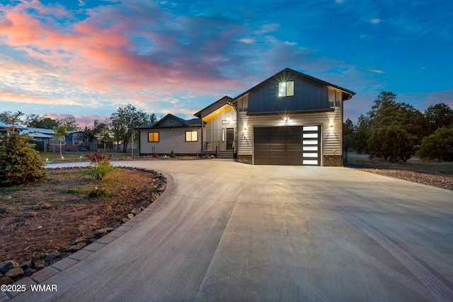 2872 Penny Ln, Lakeside, AZ 85929 - view of front of home featuring curved driveway, board and batten siding, and an attached garage
