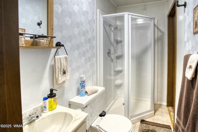 full bathroom featuring toilet, tile patterned floors, a shower stall, and vanity