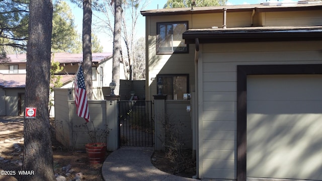 view of property exterior featuring a gate