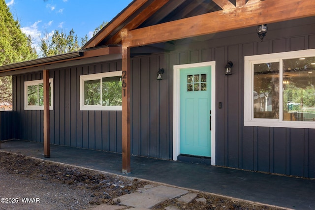 261 S 5th Pl, Show Low, AZ 85901 - property entrance with board and batten siding