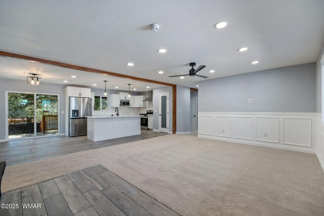 261 S 5th Pl, Show Low, AZ 85901 - unfurnished living room featuring recessed lighting, ceiling fan, and light wood finished floors
