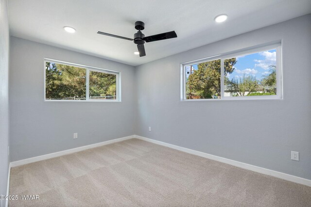 261 S 5th Pl, Show Low, AZ 85901 - spare room featuring a ceiling fan, healthy amount of natural light, light carpet, and recessed lighting