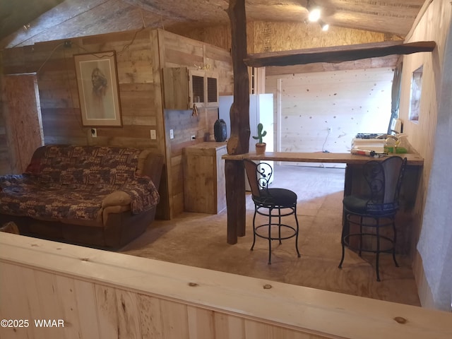 9952 S Buffalo Ridge Dr, Show Low, AZ 85901 - kitchen with vaulted ceiling, wood walls, and a breakfast bar