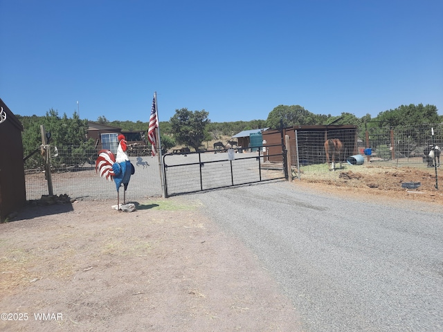 9952 S Buffalo Ridge Dr, Show Low, AZ 85901 - view of asphalt driveway with a gate and a gated entry