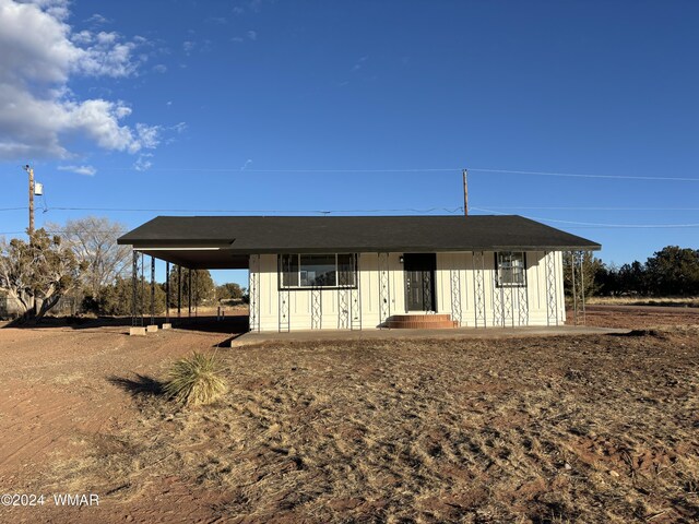 view of front of house with a carport and board and batten siding