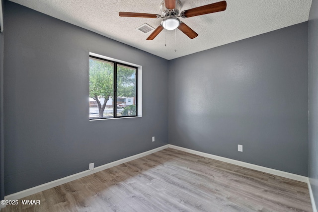 236 E 6th St, Eagar, AZ 85925 - unfurnished room featuring wood finished floors, a textured ceiling, and a ceiling fan
