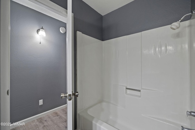 236 E 6th St, Eagar, AZ 85925 - bathroom with shower / washtub combination and wood finished floors