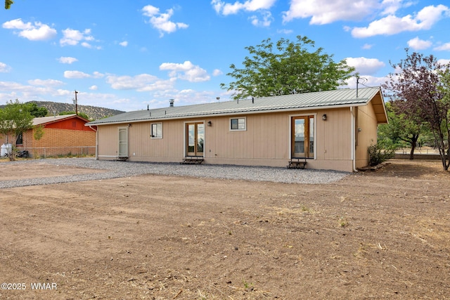 236 E 6th St, Eagar, AZ 85925 - back of house featuring entry steps, french doors, and a metal roof