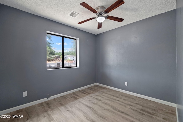 236 E 6th St, Eagar, AZ 85925 - unfurnished room with a ceiling fan, a textured ceiling, and wood finished floors
