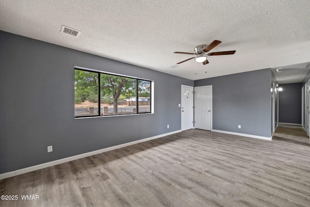 236 E 6th St, Eagar, AZ 85925 - unfurnished room featuring a textured ceiling, wood finished floors, and a ceiling fan