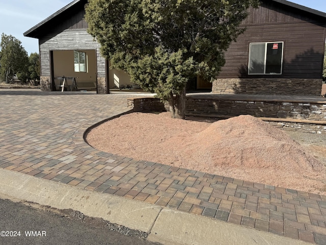 view of front of home featuring stone siding