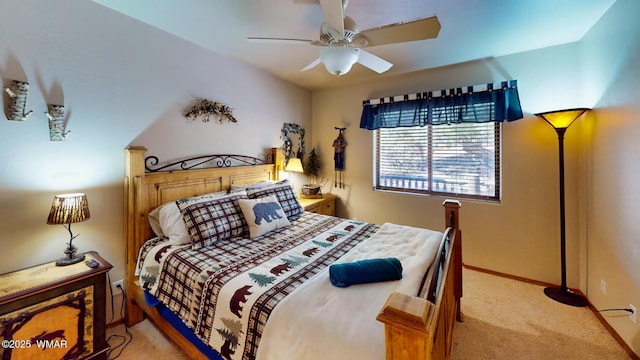 bedroom featuring baseboards, light carpet, and a ceiling fan