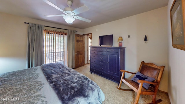 bedroom featuring light colored carpet and a ceiling fan