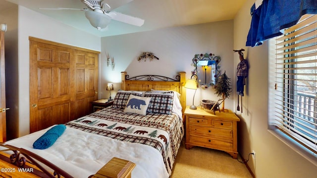 bedroom with carpet flooring, a ceiling fan, and a closet