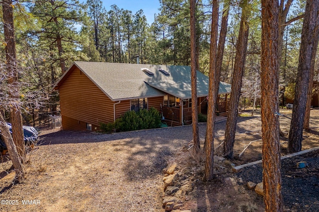 4584 Cub Lake Rd, Show Low, AZ 85901 - view of front of house featuring log veneer siding and roof with shingles