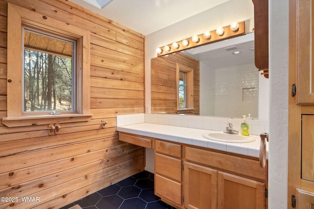 1825 E Woodchuck Ln, Pinetop, AZ 85935 - bathroom featuring wooden walls, tile patterned flooring, and vanity