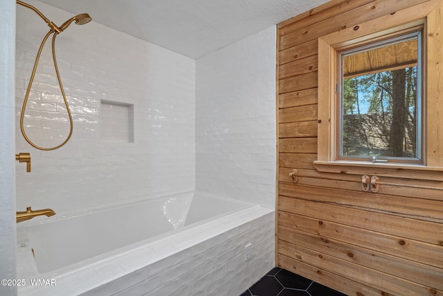 1825 E Woodchuck Ln, Pinetop, AZ 85935 - bathroom featuring wood walls, tub / shower combination, and tile patterned floors