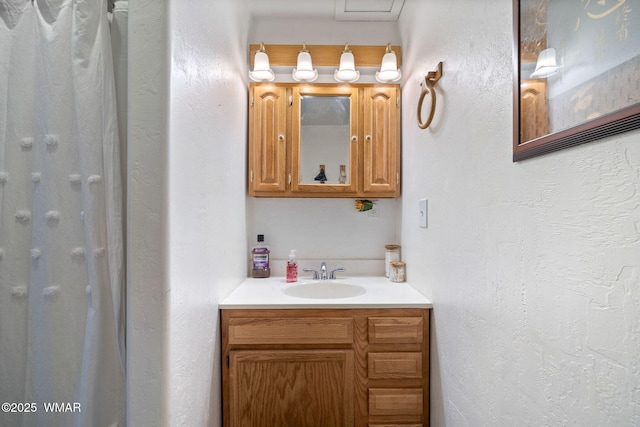 1825 E Woodchuck Ln, Pinetop, AZ 85935 - full bath with a textured wall, a shower with shower curtain, and vanity