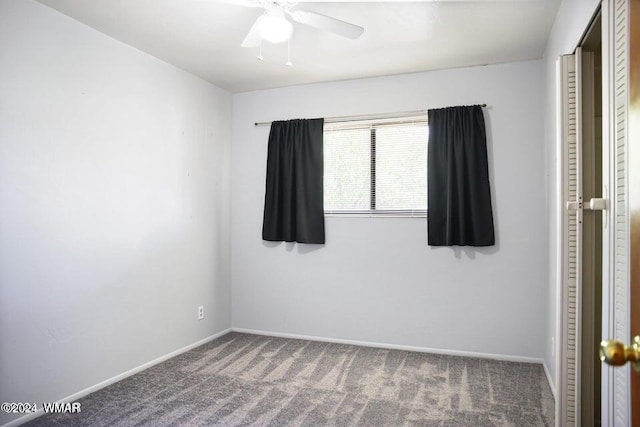 unfurnished bedroom featuring carpet floors, a ceiling fan, and baseboards