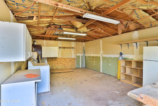 219 W Elm St, Winslow, AZ 86047 - garage with freestanding refrigerator and washer / clothes dryer