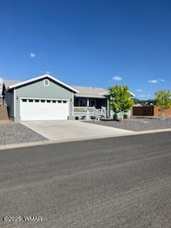 289 N Divot Dr, Eagar, AZ 85925 - ranch-style house with a garage and driveway