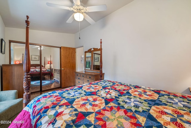 bedroom with vaulted ceiling, a closet, wood finished floors, and a ceiling fan