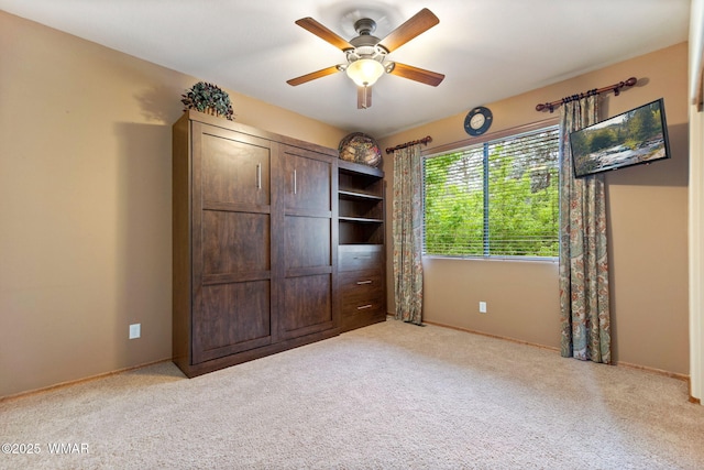 380 N Retreat Dr, Show Low, AZ 85901 - unfurnished bedroom with carpet, baseboards, and a ceiling fan