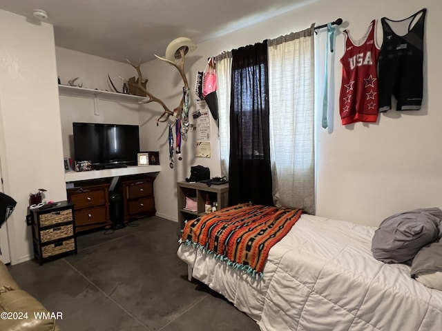 bedroom with concrete flooring