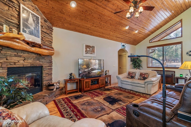 1430 E Pine Oaks Dr, Show Low, AZ 85901 - living room with arched walkways, wooden ceiling, ceiling fan, high vaulted ceiling, and a stone fireplace