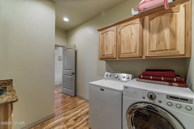 1430 E Pine Oaks Dr, Show Low, AZ 85901 - laundry area featuring cabinet space, washer and clothes dryer, and light wood-type flooring