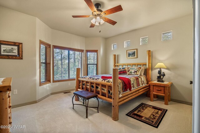 1430 E Pine Oaks Dr, Show Low, AZ 85901 - carpeted bedroom featuring baseboards and a ceiling fan