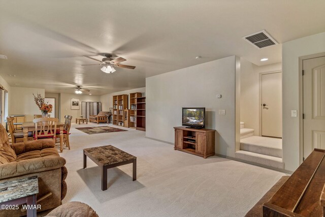 1430 E Pine Oaks Dr, Show Low, AZ 85901 - living room with light colored carpet, a ceiling fan, and stairs