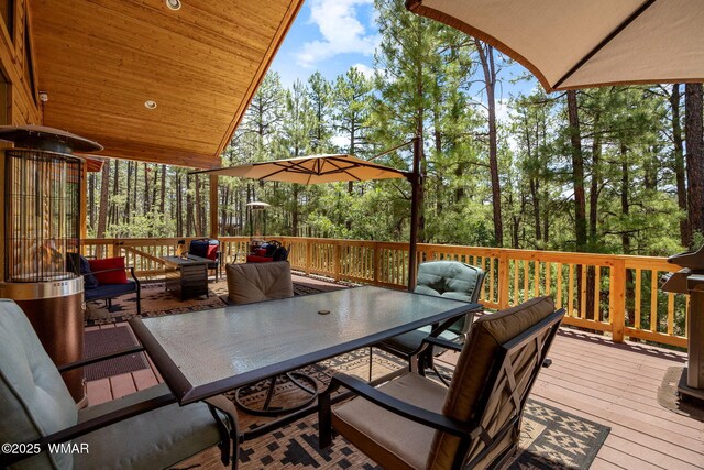 1430 E Pine Oaks Dr, Show Low, AZ 85901 - deck featuring outdoor dining space and view of scattered trees