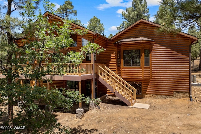 1430 E Pine Oaks Dr, Show Low, AZ 85901 - rear view of property featuring faux log siding, stairway, and a deck