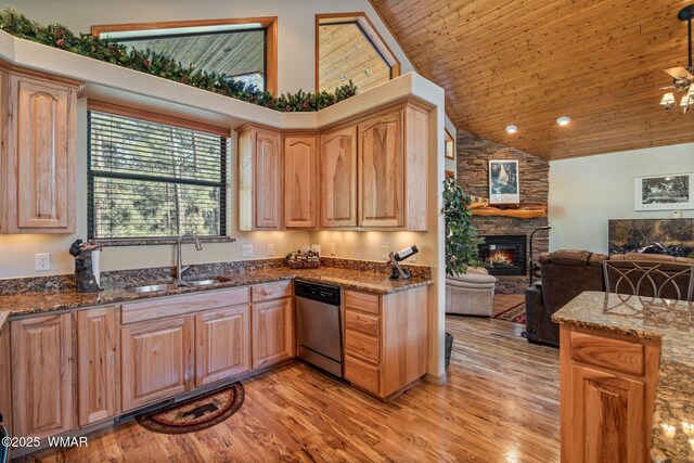 1430 E Pine Oaks Dr, Show Low, AZ 85901 - kitchen featuring dishwasher, high vaulted ceiling, open floor plan, light wood-style flooring, and a stone fireplace