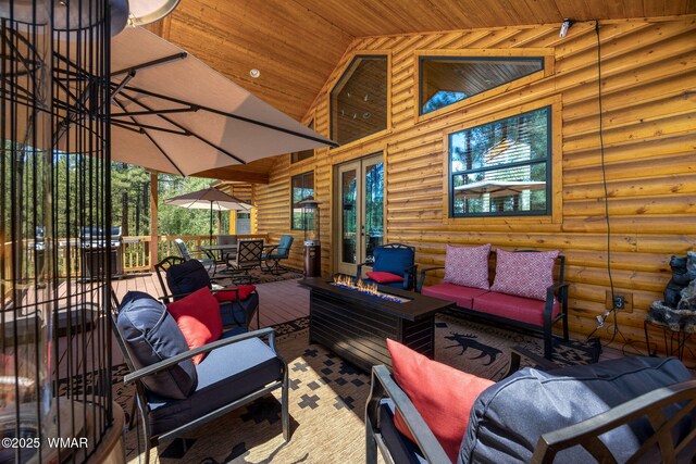 1430 E Pine Oaks Dr, Show Low, AZ 85901 - wooden deck featuring an outdoor living space with a fire pit, french doors, and outdoor dining area