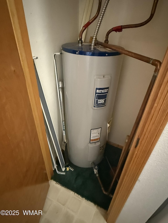 utility room featuring water heater