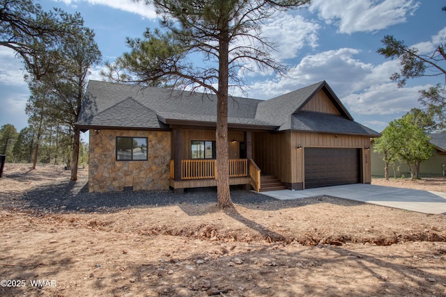 1028 School House Ln, Show Low, AZ 85901 - view of front facade featuring a porch, an attached garage, driveway, a shingled roof, and stone siding