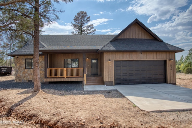 1028 School House Ln, Show Low, AZ 85901 - view of front of home featuring covered porch, an attached garage, driveway, and roof with shingles