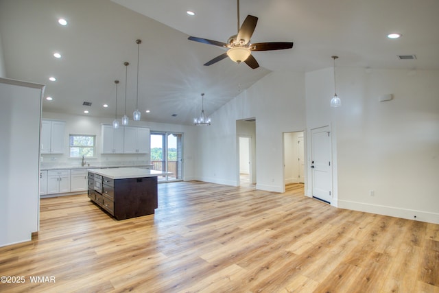 1028 School House Ln, Show Low, AZ 85901 - kitchen with light countertops, open floor plan, high vaulted ceiling, a center island, and recessed lighting