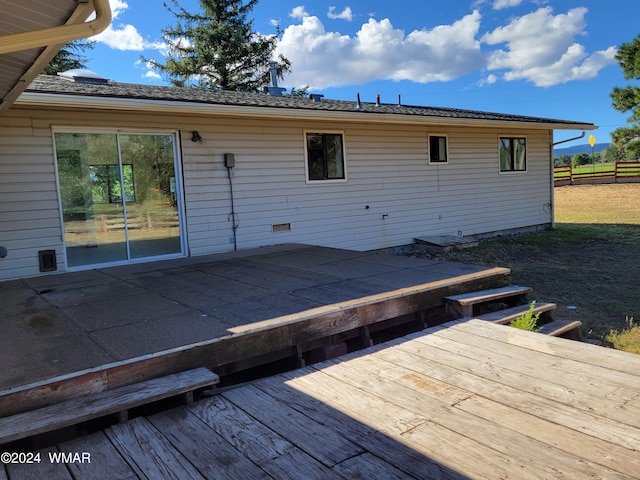 exterior space with a wooden deck and fence