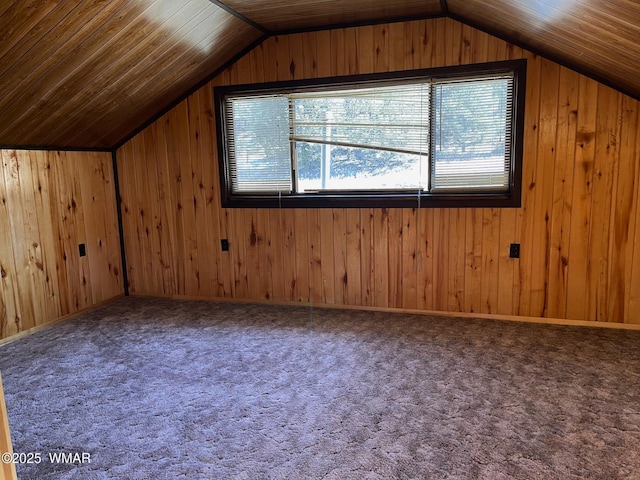 bonus room with lofted ceiling, carpet, wood ceiling, and wooden walls