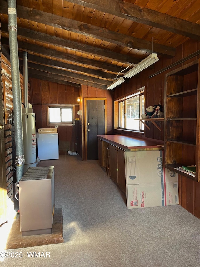 interior space featuring wooden walls, wood ceiling, washer / clothes dryer, beamed ceiling, and water heater