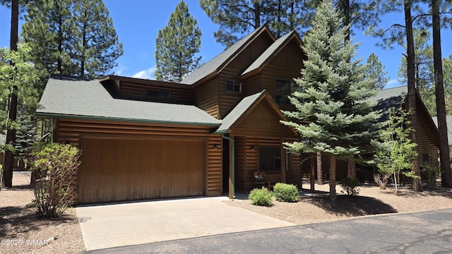 3024 Buck Crossing Way, Pinetop, AZ 85935 - view of front of property featuring an attached garage, driveway, roof with shingles, and faux log siding
